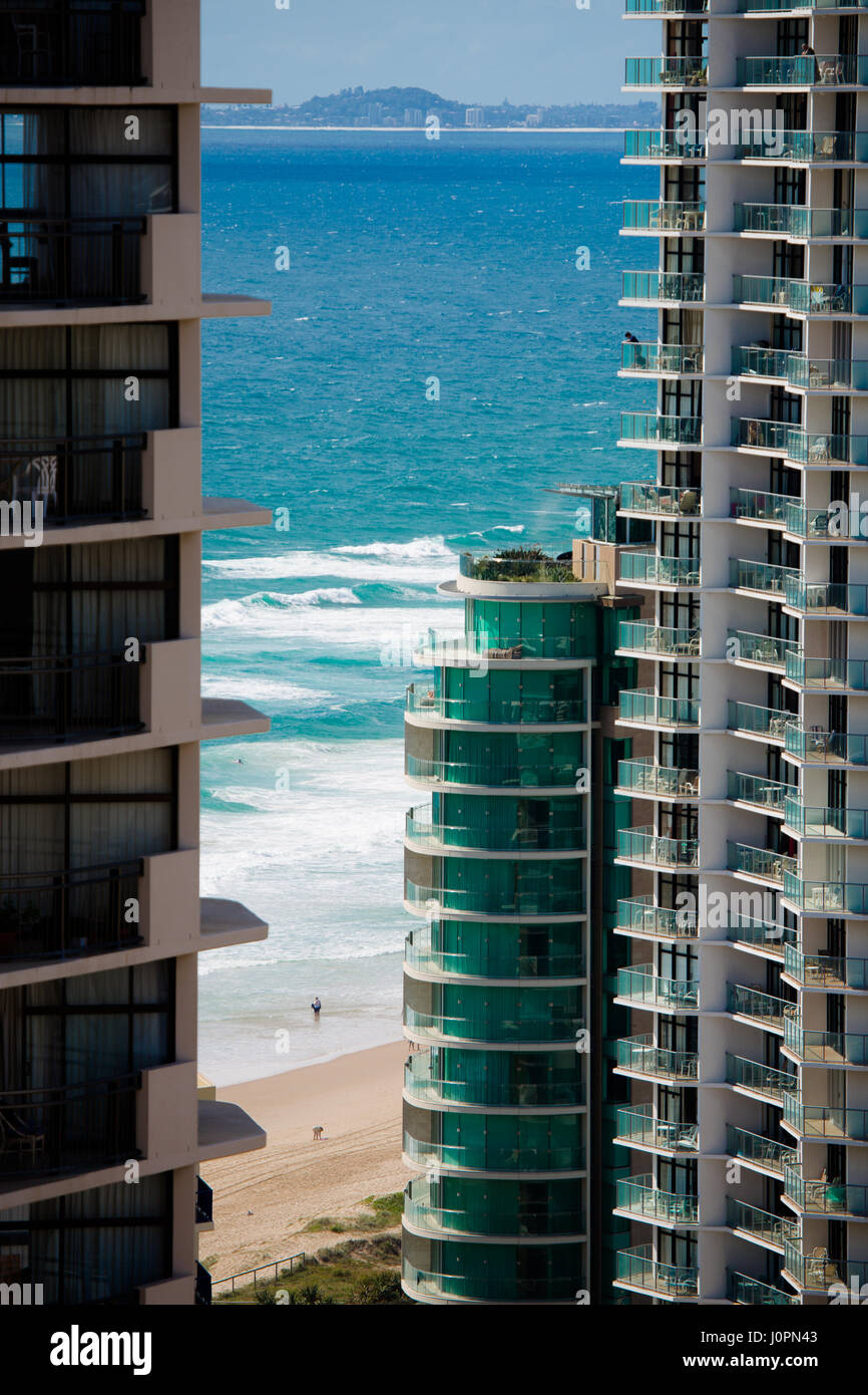 The famous surf of the Gold Coast through the accommodation towers blocks and apartment buildings, Queensland, Australia Stock Photo