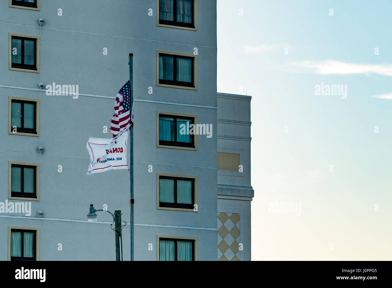 American flag and Trump flag in front of beach front condos Stock Photo