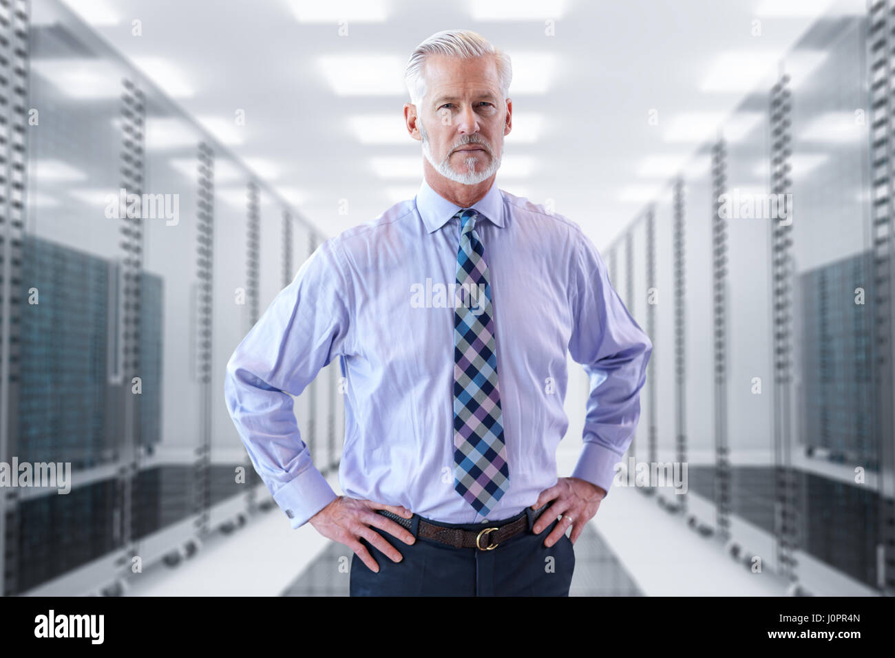Portrait of senior businessman in big rack server room Stock Photo - Alamy