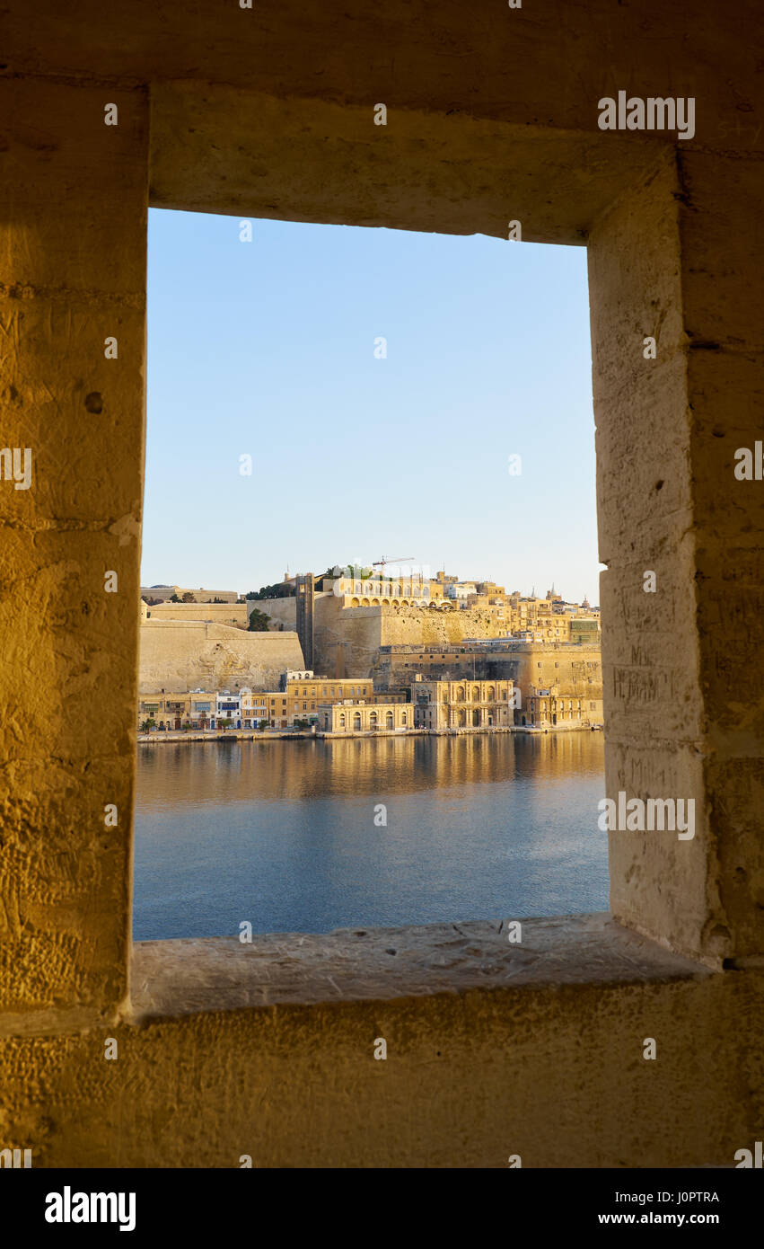 The view of Valletta Fort Lascaris from the window of Guard tower on the end of Senglea (L-isla) peninsula bastion. Senglea, Malta Stock Photo