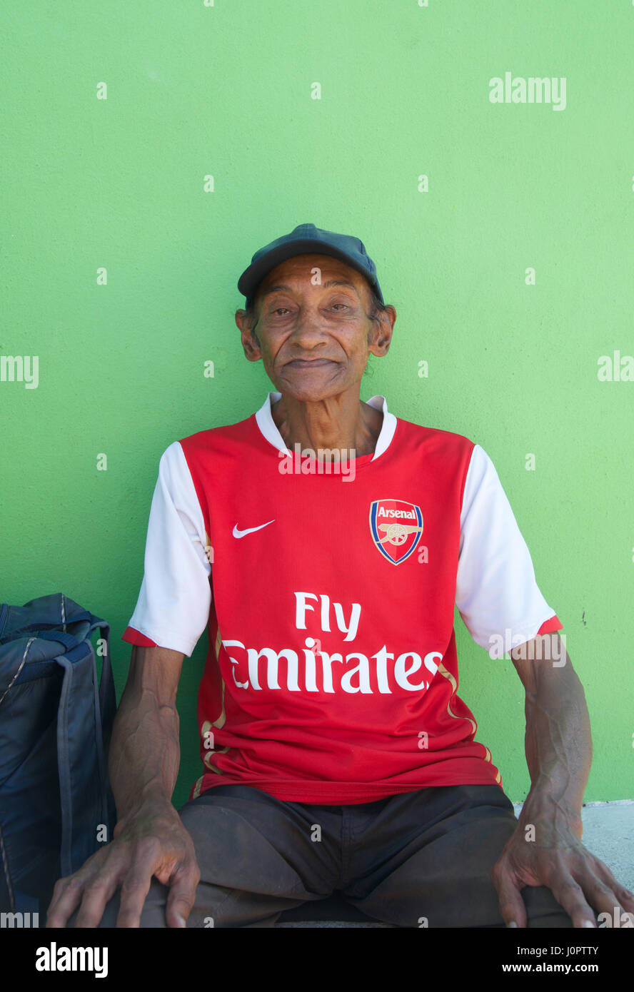 Portrait Malay Muslim man wearing Arsenal shirt Bo Kaap Cape Town South Africa Stock Photo