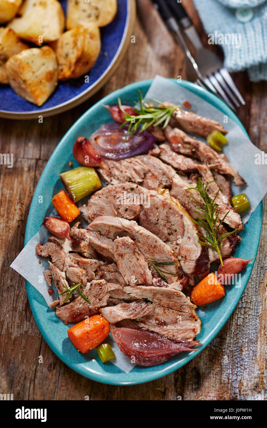 Slow cooked roast lamb with vegetables Stock Photo - Alamy