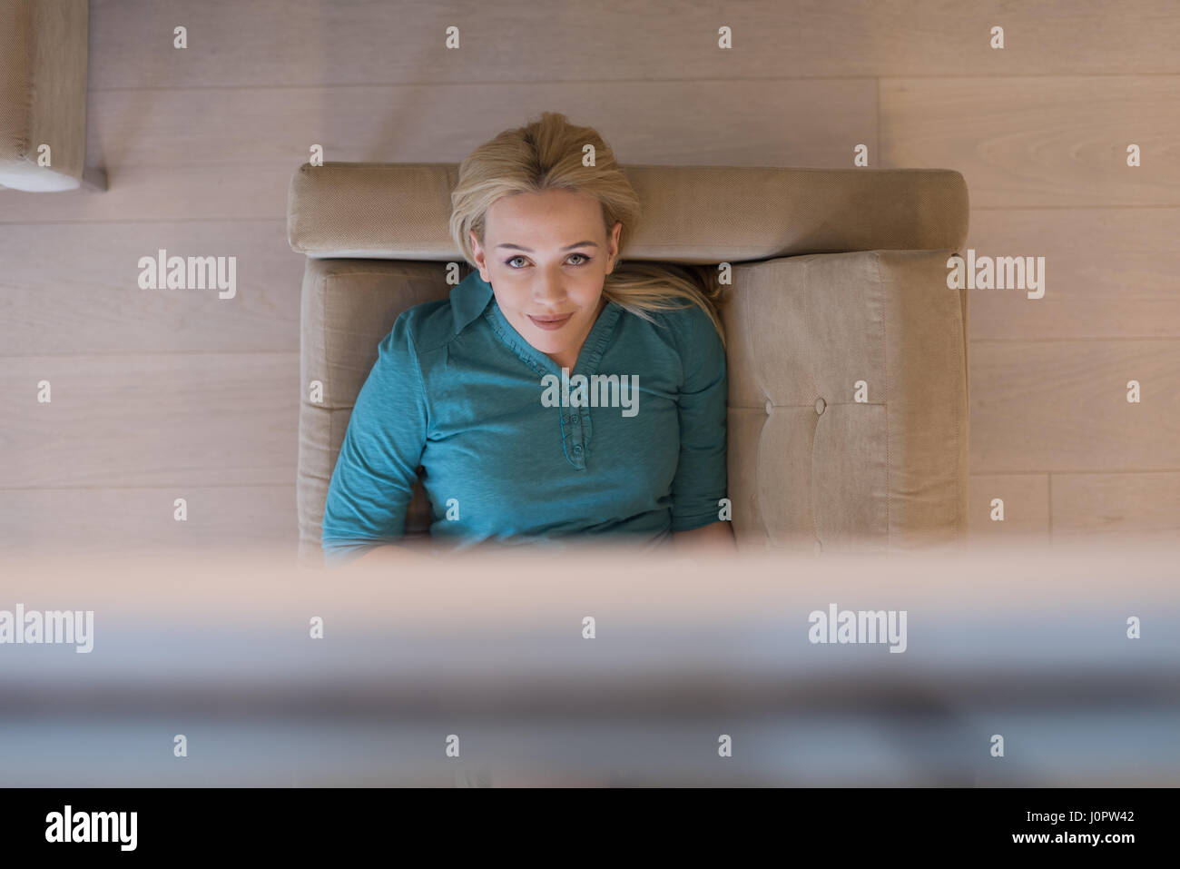 young happy woman on sofa using tablet computer at luxury home Stock ...