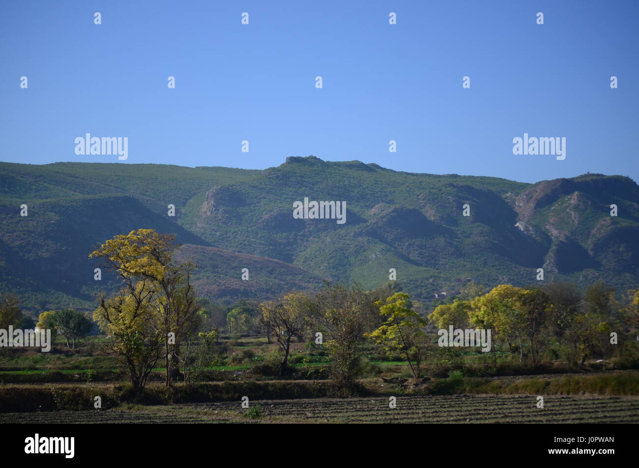 Mountains and fields in mysterious place of Punjab Pakistan Stock Photo