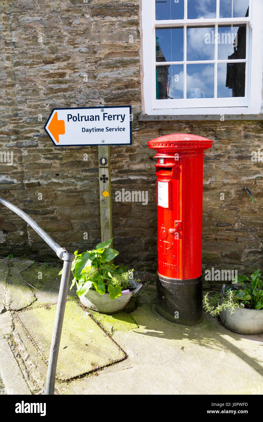 A freshly painted George VI pillar box in the centre of the historic port of Fowey, Cornwall, England Stock Photo