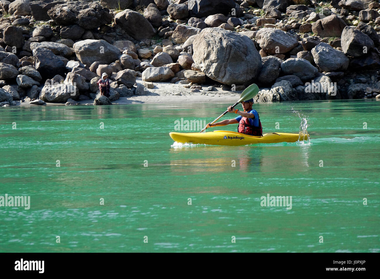 Man kayaking in Ganga Mountain River. Stock Photo