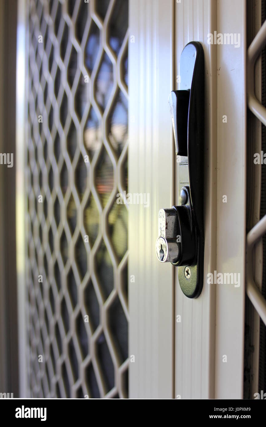 Close up photo of security door lock on suburban home Stock Photo