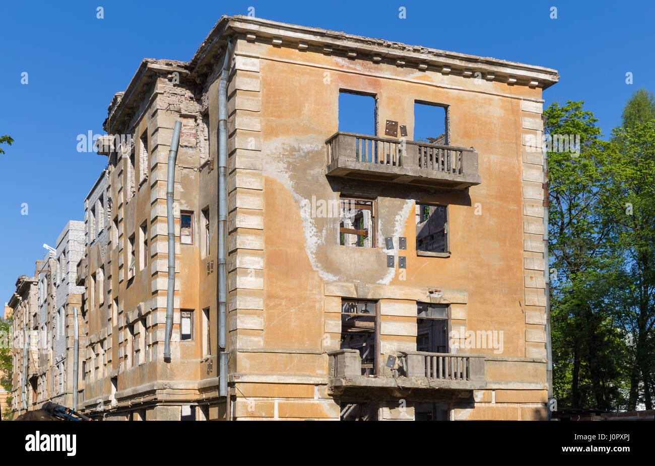 Abandoned building - broken tenement apartment house in daylight Stock ...