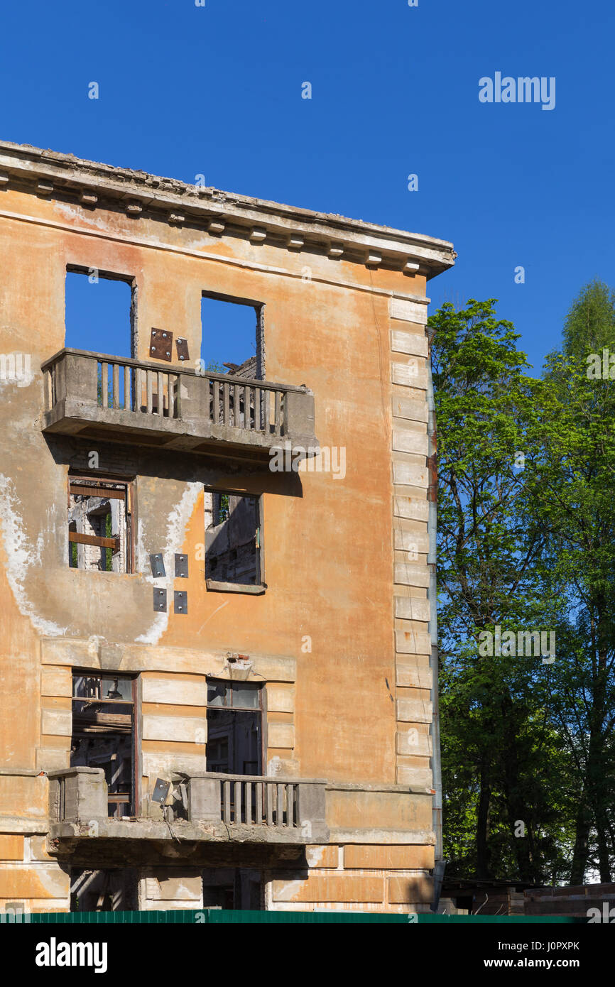 Abandoned building - broken tenement apartment house in daylight Stock ...