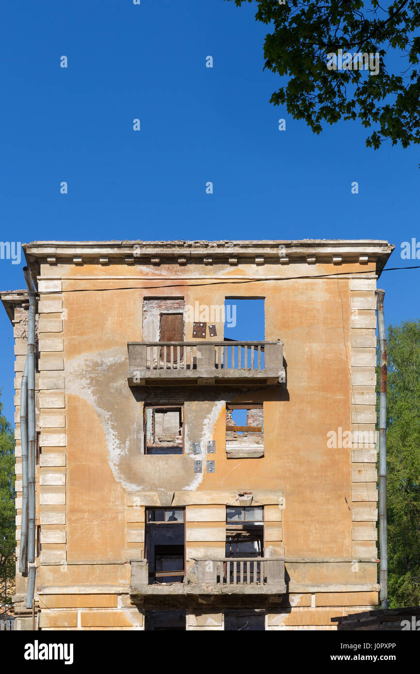 Abandoned building - broken tenement apartment house in daylight Stock ...