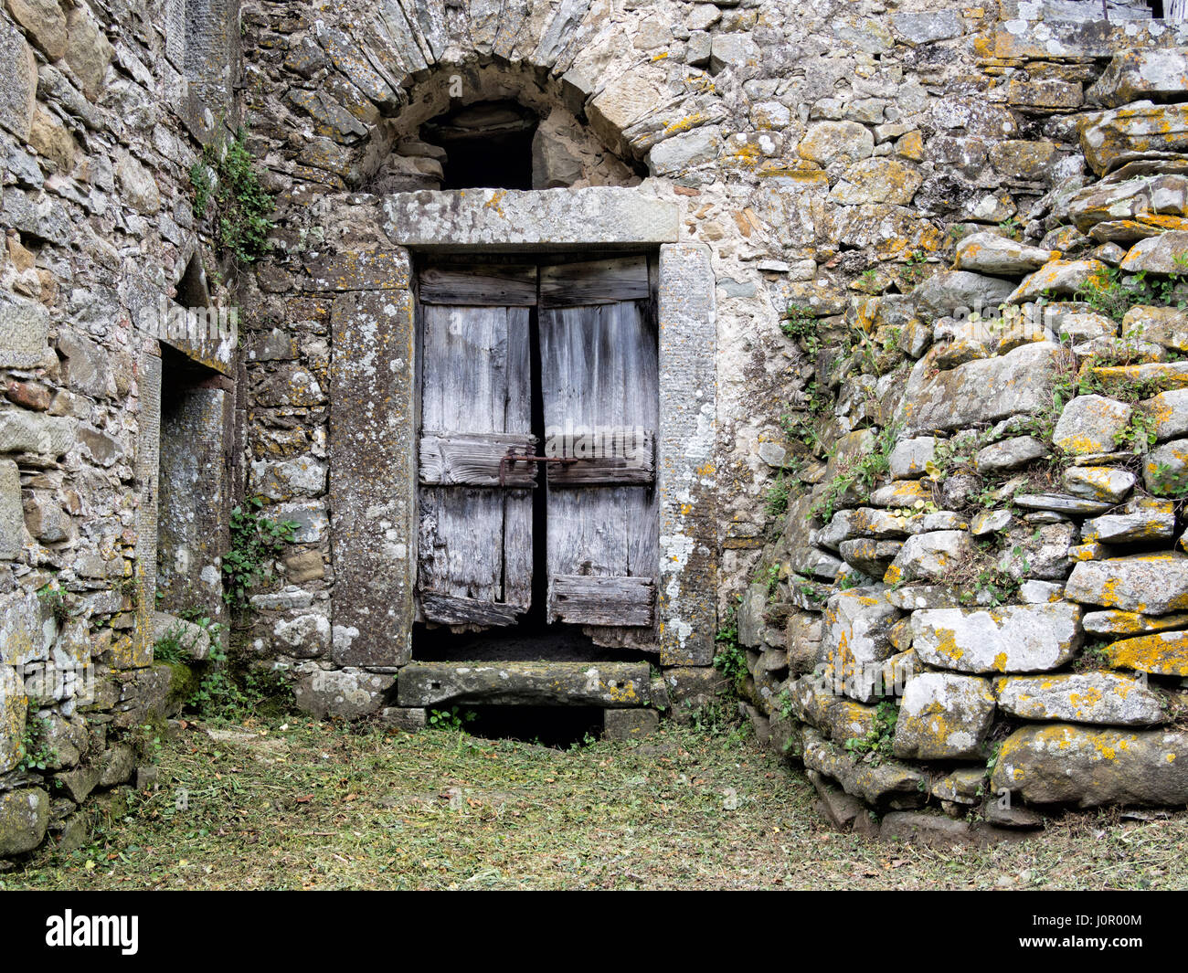 Ancient stone doorway, clearly altered over time. Stock Photo