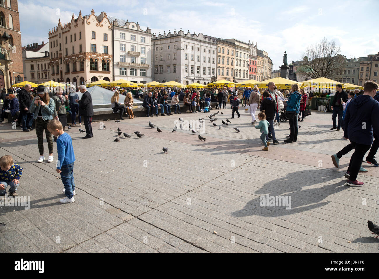 Busy market square in Krakow, Poland Stock Photo