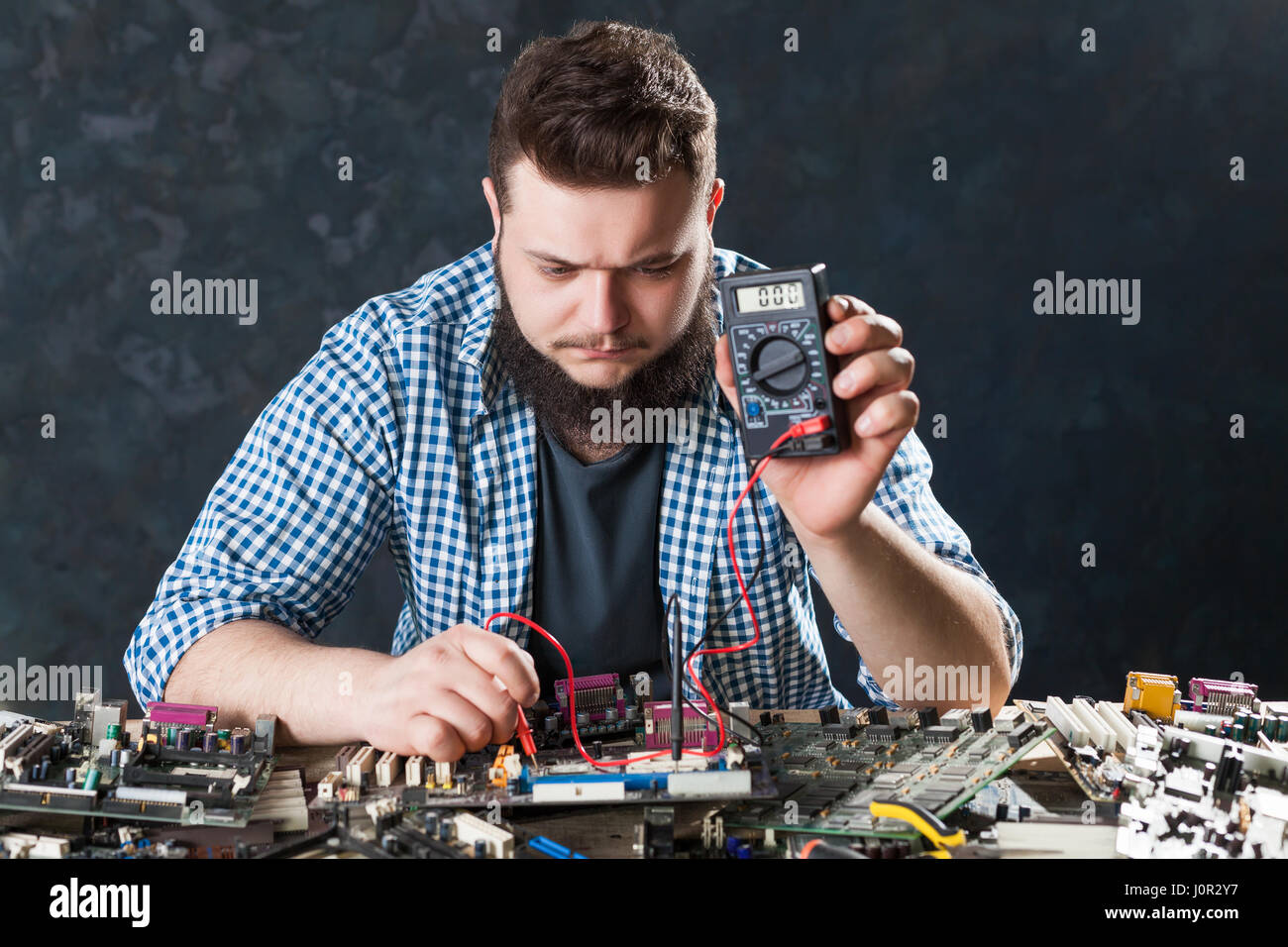 Computer hardware or electronic components diagnostic. Male engineer ...