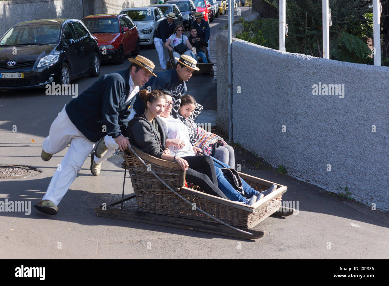 Tourists enjoying the Monte toboggan run, Madeira Stock Photo Alamy