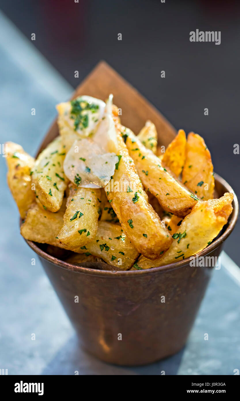 Garlic french fries, parsley garnish Stock Photo Alamy