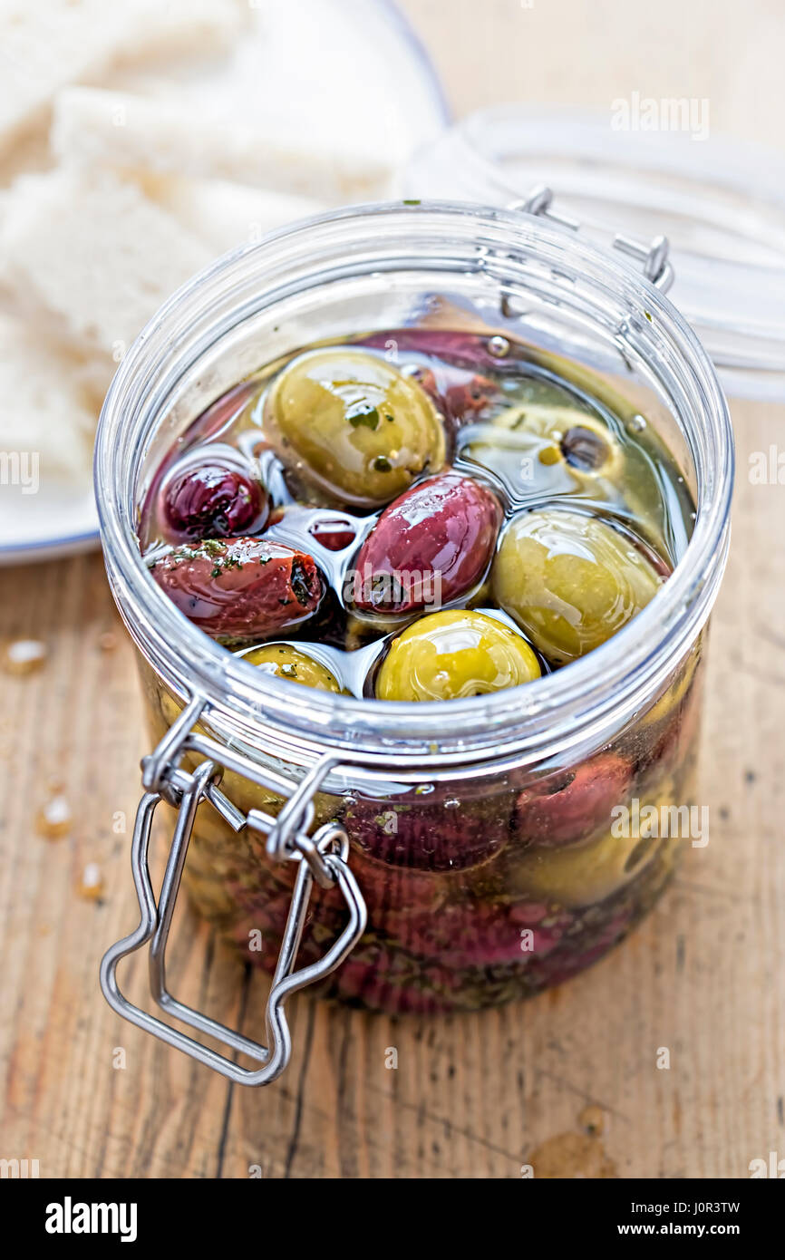 Mixed olives in jar Stock Photo Alamy
