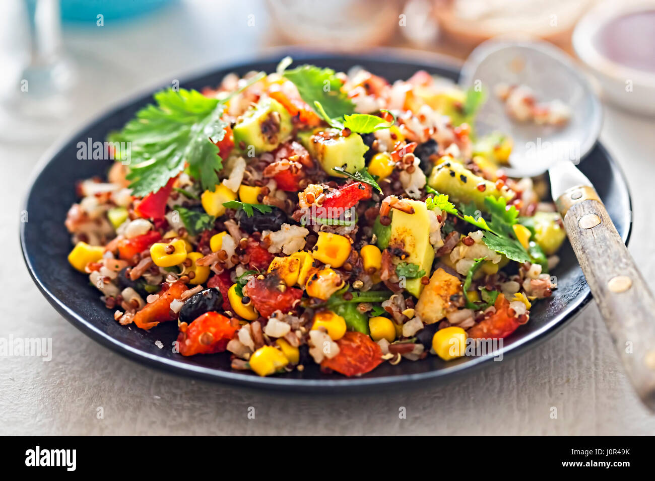 Mexican rice, quinoa avocado salad with chilli dressing Stock Photo Alamy