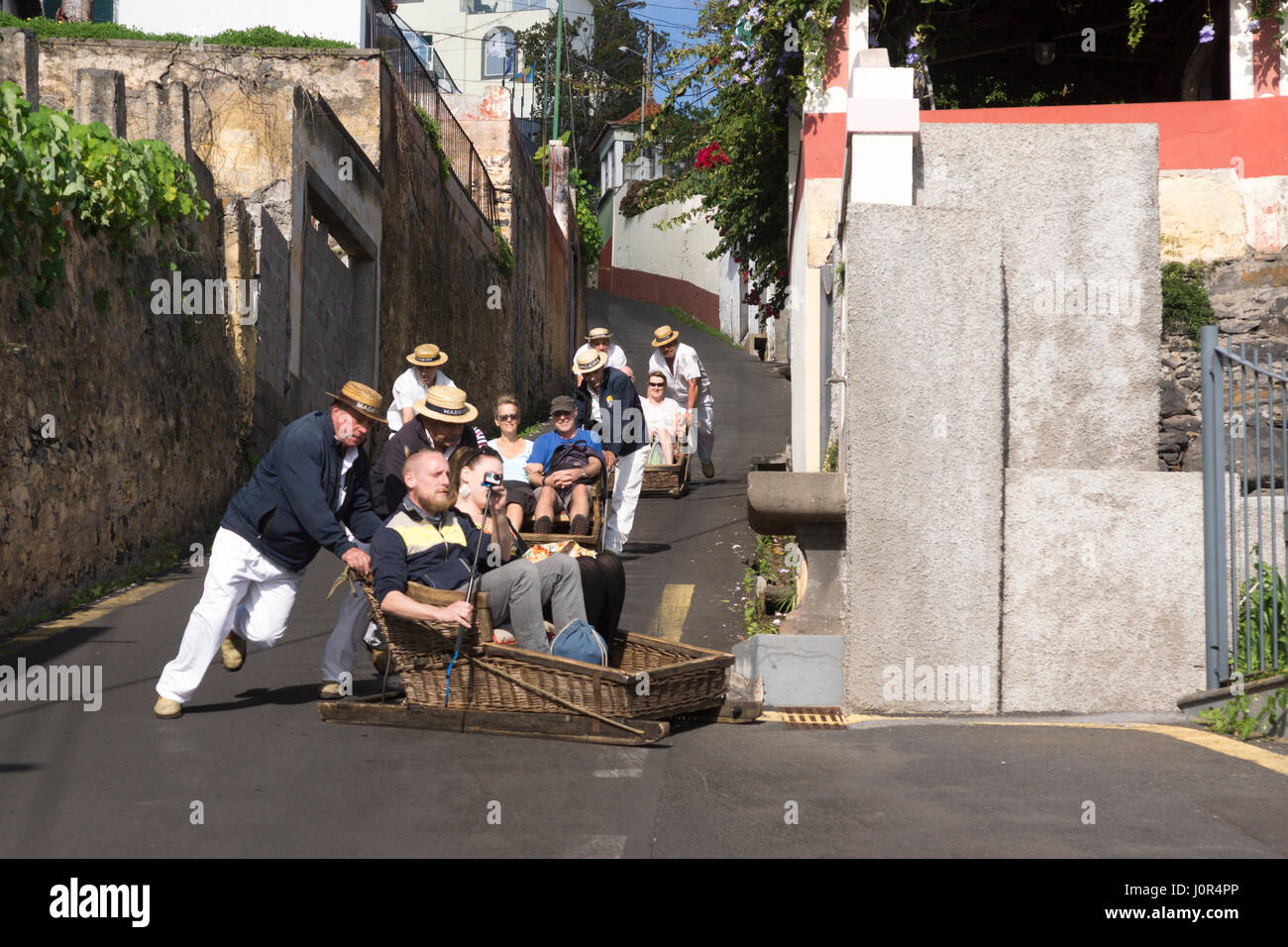 Tourists enjoying the Monte toboggan run, Madeira Stock Photo Alamy
