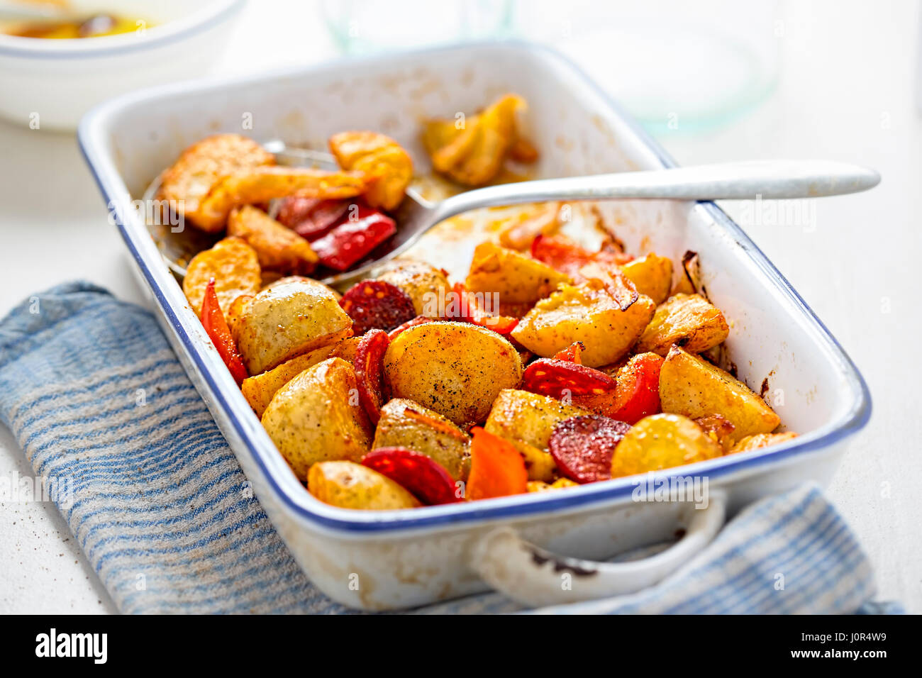 Chorizo, potato, red pepper onion tray bake Stock Photo Alamy