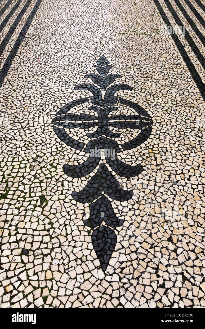 A calçada (Portugese style) pavement after rainfall in Funchal, Madeira Stock Photo