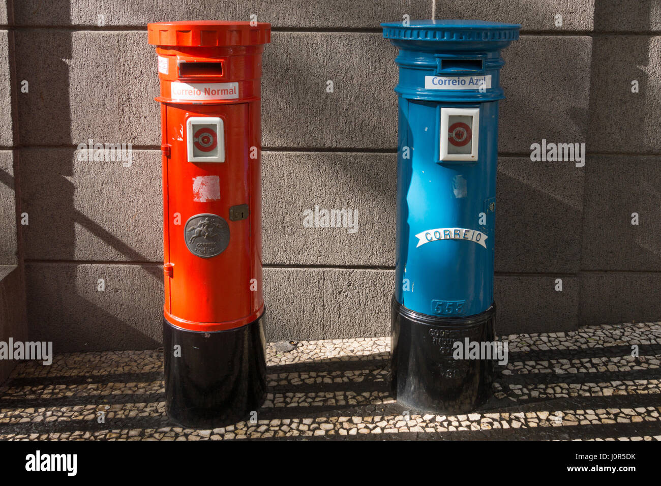 A first class (Correio Azul) and second class (Correio Normal) pillar box outside the Portugal Telecom building in Funchal, Madeira Stock Photo