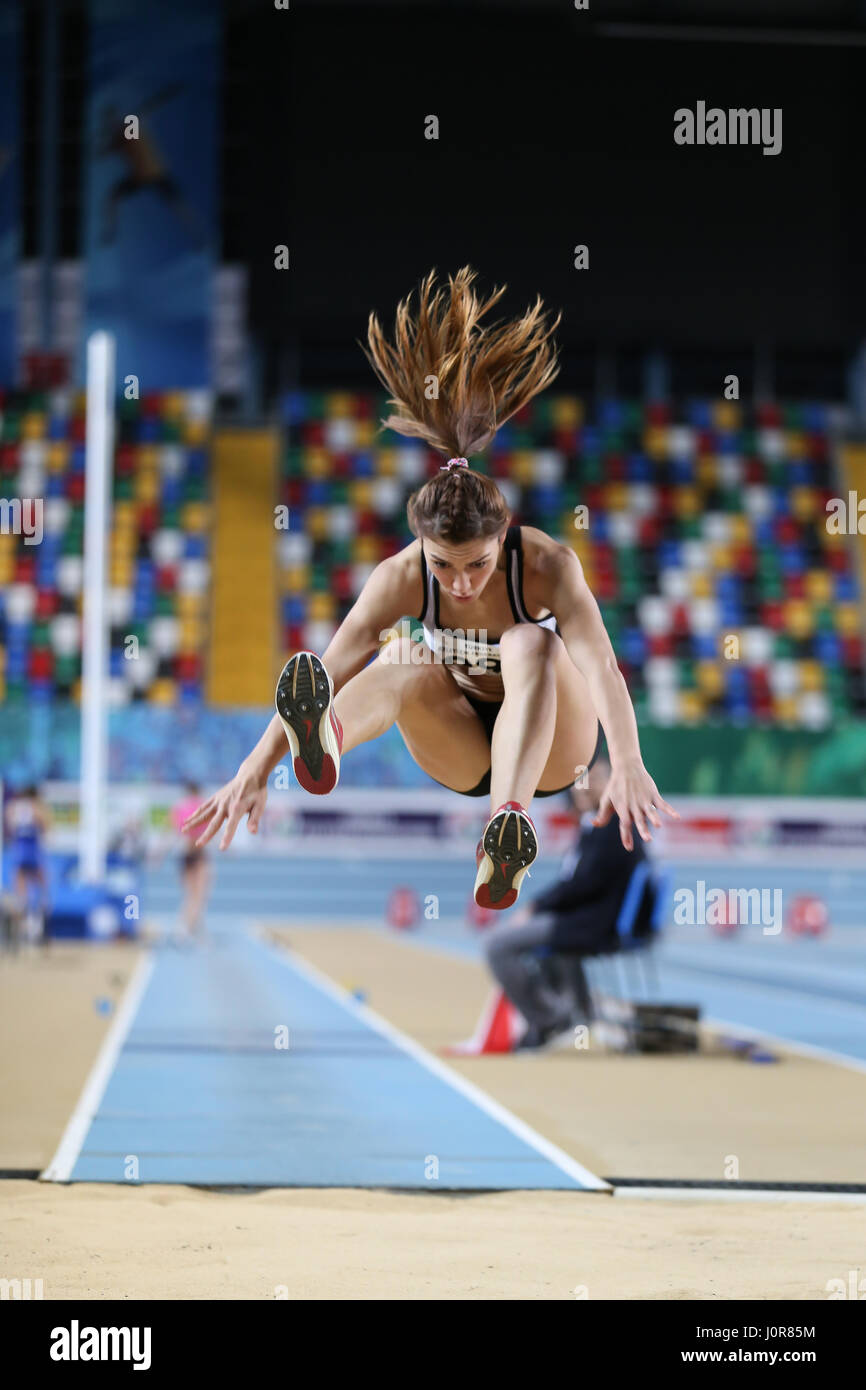 ISTANBUL, TURKEY - JANUARY 14, 2017: Athlete Tugba Aydin triple jumping ...