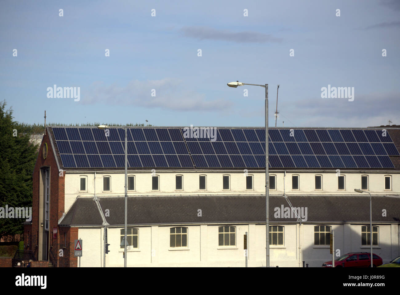 St Rochs Glasgow church chapel with green electricity solar panels covering roof Stock Photo