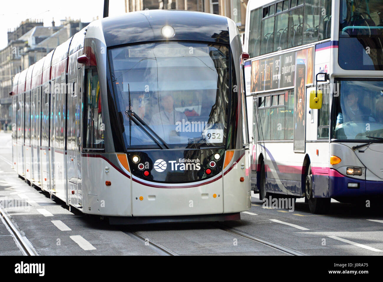 A tram makes its way through Edinburgh city centre in the final stages of testing for the capital's new tramway system Stock Photo