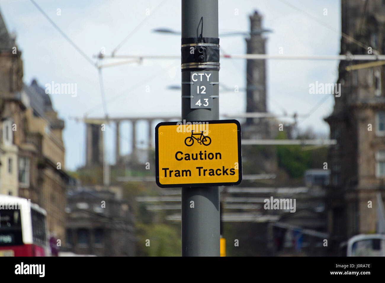 A warning to cyclists in Edinburgh city centre during the final stages of testing for the capital's new tramway system Stock Photo