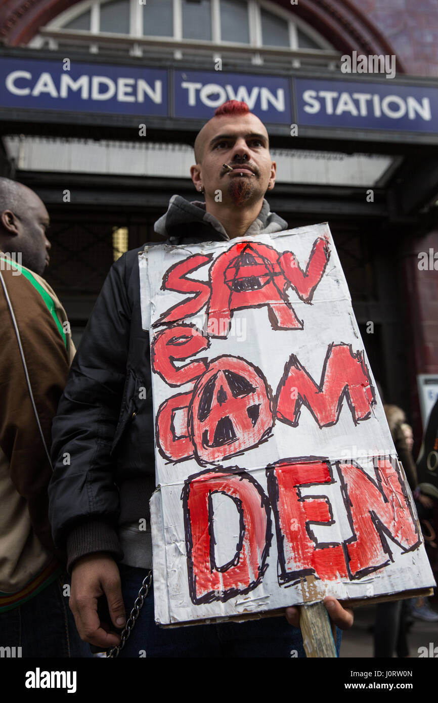 London, UK. 15th April, 2017. An anti-gentrification campaigner waits with a placard for a Save Camden Market protest to assemble outside Camden Town station. Credit: Mark Kerrison/Alamy Live News Stock Photo