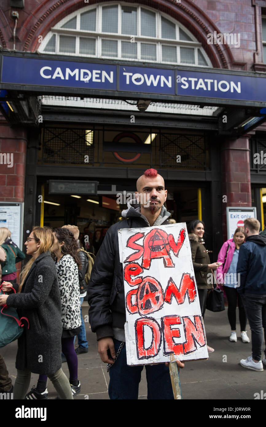 London, UK. 15th April, 2017. An anti-gentrification campaigner waits with a placard for a Save Camden Market protest to assemble outside Camden Town station. Credit: Mark Kerrison/Alamy Live News Stock Photo