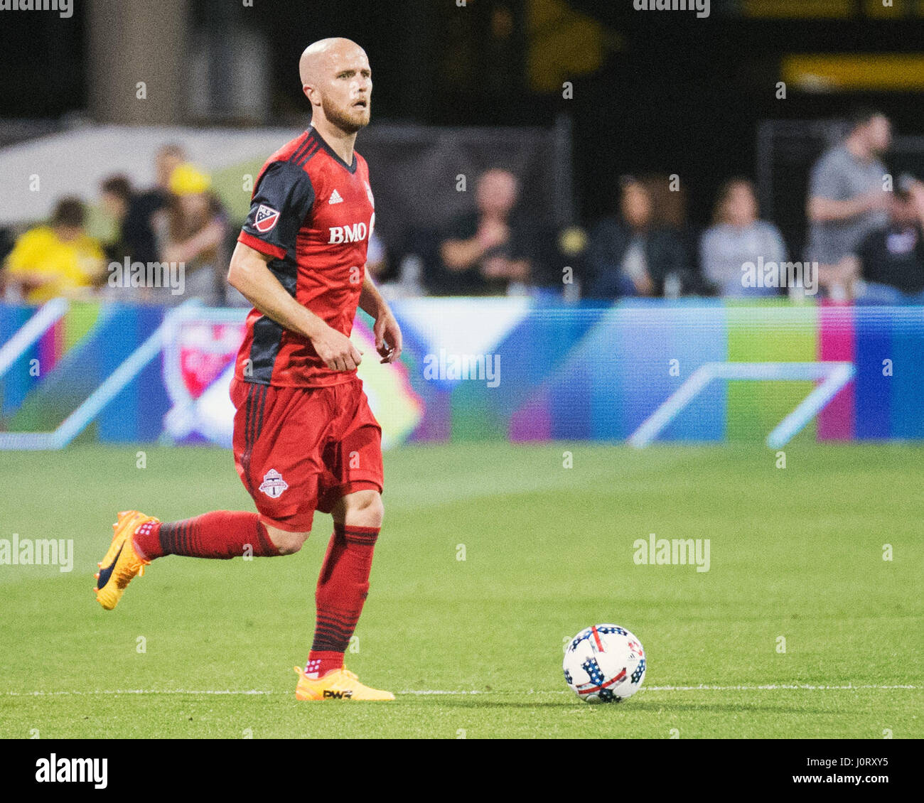 Columbus, Ohio, USA. 15th April, 2017. Toronto FC midfielder Michael Bradley (4) dribbles the ball down the pitch against Columbus in their game at Mapfe Stadium in Columbus, Ohio, USA. Brent Clark/Alamy Live News Stock Photo