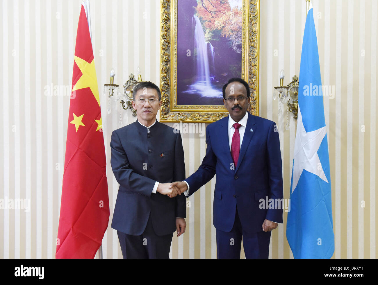 Mogadishu. 15th Apr, 2017. Somali President Mohamed Abdullahi Mohamed (R) shakes hands with new Chinese Ambassador to Somalia Qin Jian in Mogadishu April 15, 2017. Credit: Li Baishun/Xinhua/Alamy Live News Stock Photo