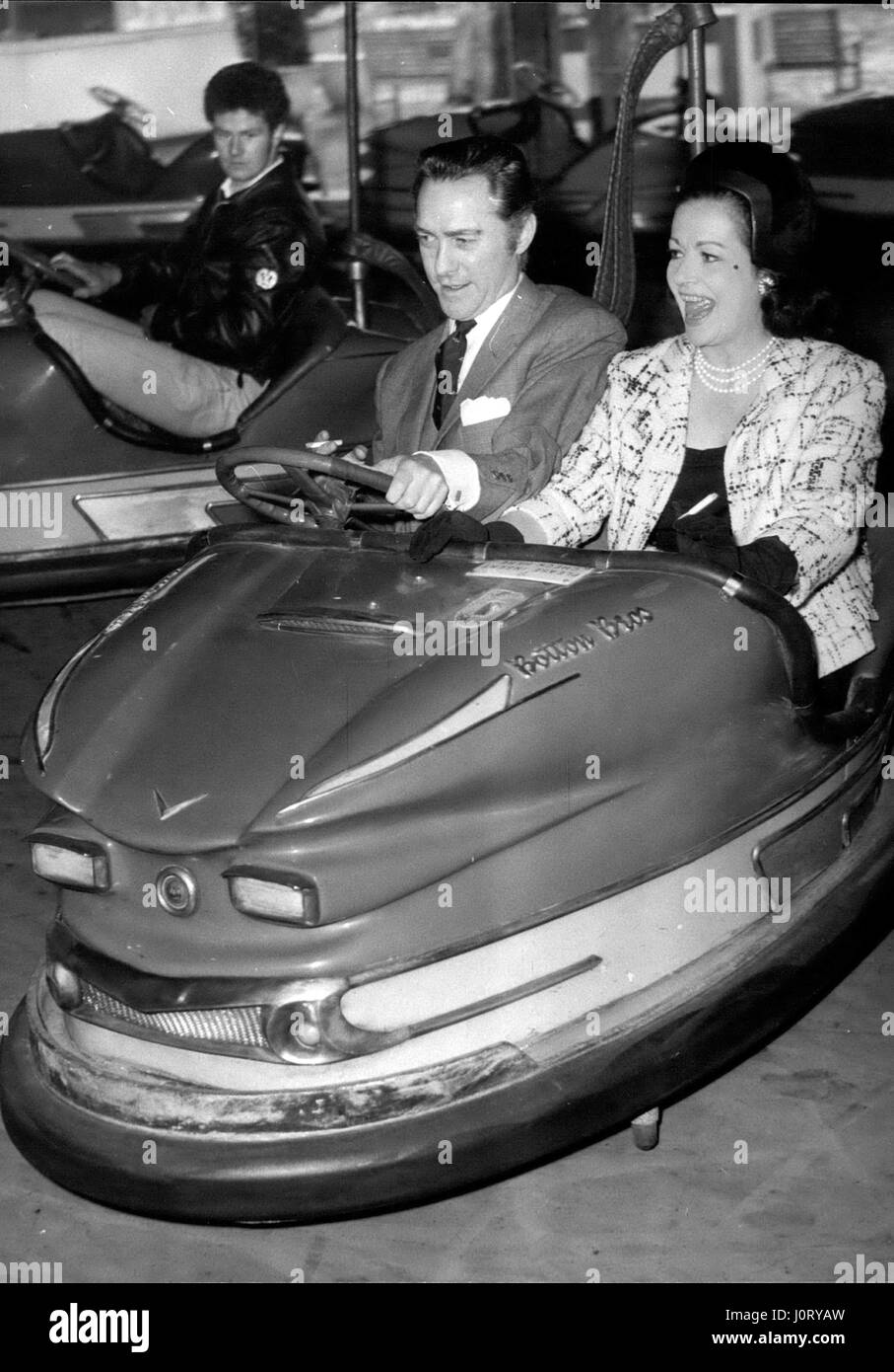Apr. 04, 1966 - The opening of the Battersea Festival Gardens and Fun Fair: Actress Margaret Lockwood and actor Richard Tood, who play opposite each other in Oscar Wilde's ''An Ideal Husband'' at the Strand Theatre, were the quests of honour this afternoon at the opening of the Battersea Festival and Fun Fair. Photo Shows Margaret Lockwood and Richard Todd enter into the the holiday spirit as they take a ride on the dodgem cars at the fair today. (Credit Image: © Keystone Press Agency/Keystone USA via ZUMAPRESS.com) Stock Photo