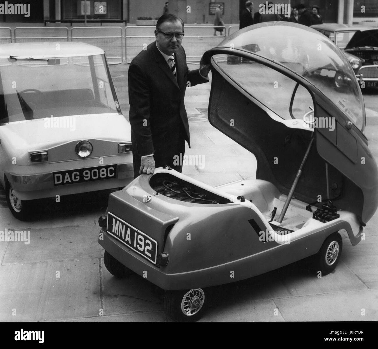 Mar. 03, 1966 - Battery Electric Vehicles demonstrated: Two battery electric Mini's converted from conventional 10 engine driver and an experimental purpose built short range electric car called the '''Scamp'' were demonstrated in the heart of the City of London today. Instead of filling up with fuel the cars plug in to cheap off peak electricity giving running cost of about d per mile. The cars were shown by the Electricity Council as a stage in the evolution of an all purpose, short range commuting and town centre car. The mini conversions are part of the Electricity Council's Appliance and Stock Photo
