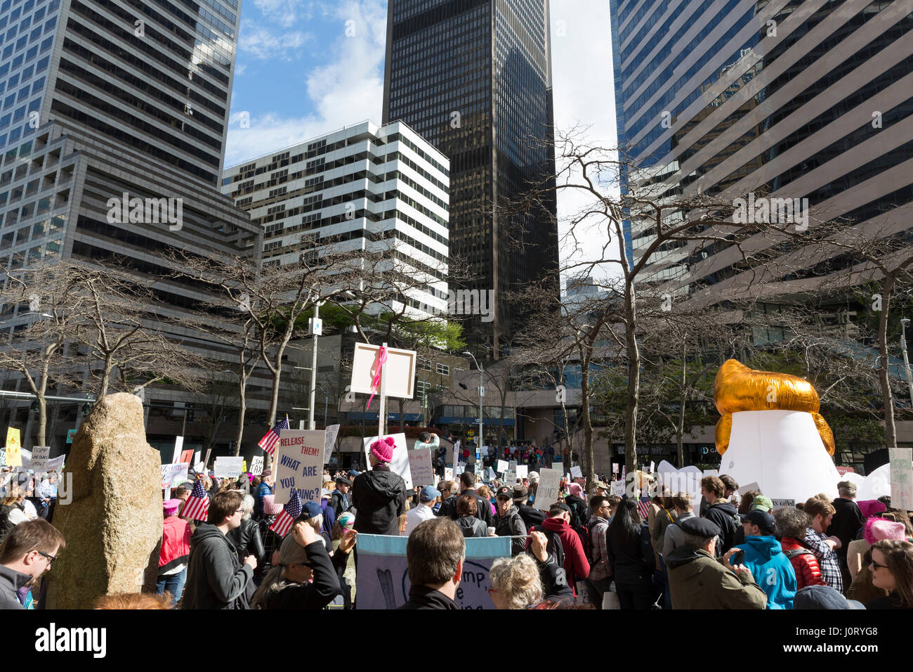 Seattle, Washington, USA. 15th April, 2017. Hundreds of protestors attended Tax March Seattle, a rally and sister march to the National Tax March taking place in over 180 communities across the U.S. Activists are demanding that President Trump release his tax returns and reveal his business dealings, financial ties, and any potential conflicts of interests. Credit: Paul Gordon/Alamy Live News Stock Photo
