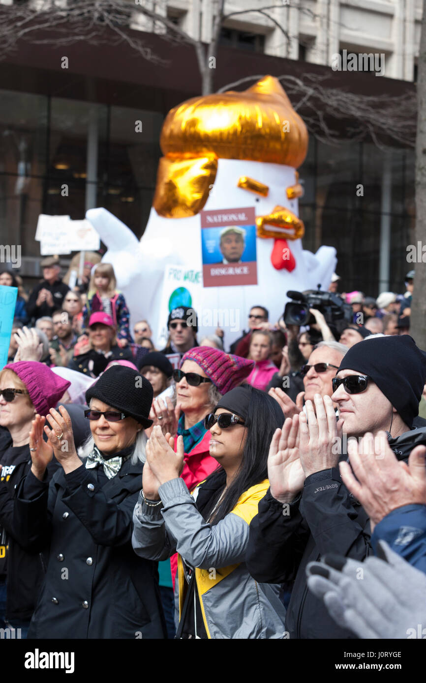 Seattle, Washington, USA. 15th April, 2017. Hundreds of protestors attended Tax March Seattle, a rally and sister march to the National Tax March taking place in over 180 communities across the U.S. Activists are demanding that President Trump release his tax returns and reveal his business dealings, financial ties, and any potential conflicts of interests. Credit: Paul Gordon/Alamy Live News Stock Photo