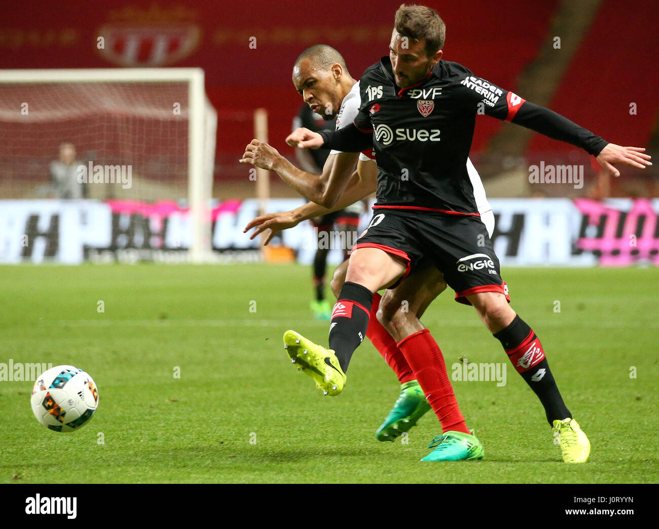 Fontvieille. 15th Apr, 2017. Romain Amalfitano (Front) of Dijon competes with Fabinho of AS Monaco during their match in Fontvielle, Monaco on April 15, 2017. AS Monaco won 2-1. Credit: Serge Haouzi/Xinhua/Alamy Live News Stock Photo