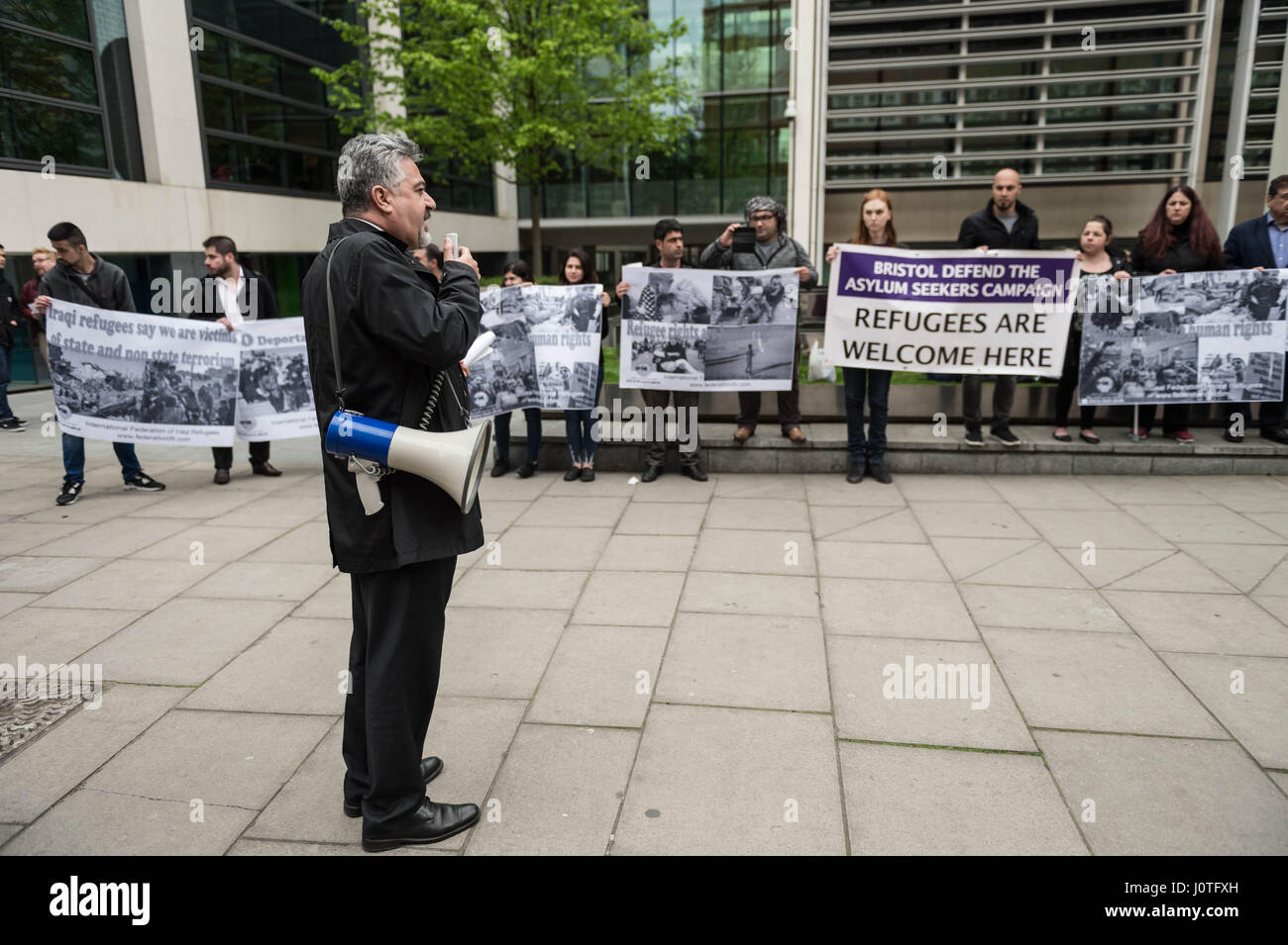 London, UK. 13th April, 2017. Dashty Jamal addresses members of the UK's Iraqi community and supporters attending an emergency demonstration opposite the Home Office organised by the International Federation of Iraqi Refugees to protest against the detention of 30 Iraqi refugees during the past week, believed to be in preparation for a mass deportation charter flight to Iraq. © Guy Corbishley/Alamy Live News Stock Photo
