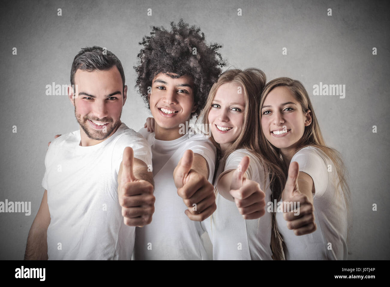 2 men and 2 women supporting you Stock Photo