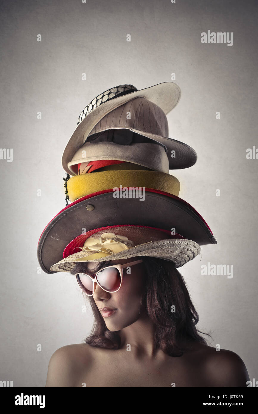 Woman wearing multiple hats Stock Photo Alamy