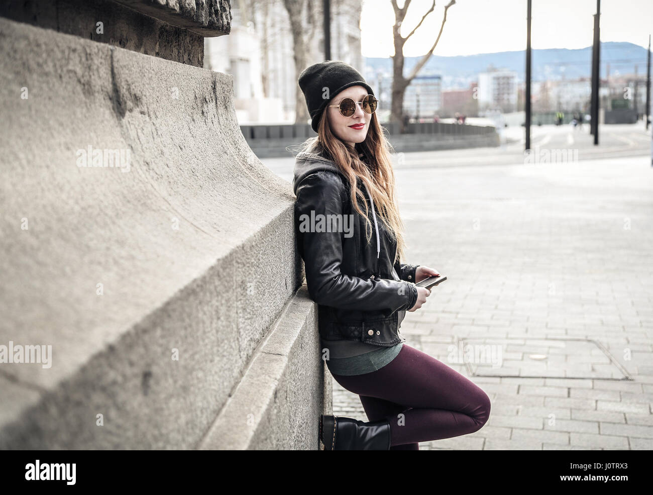 Young woman posing in the city Stock Photo