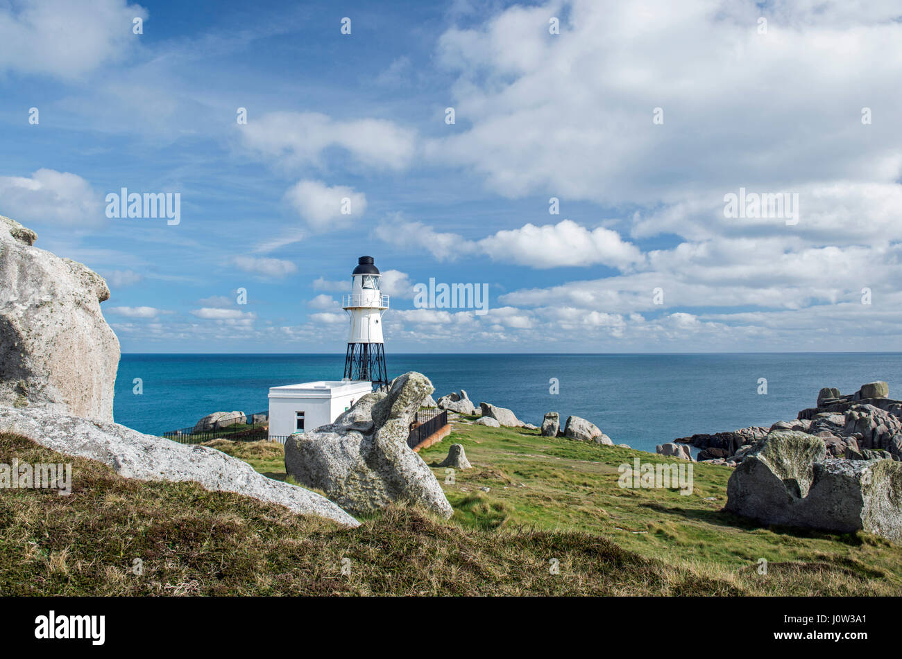 Peninnis Headland showing the lighthouse and granite Rocks on St Marys, Isles of Scilly Stock Photo