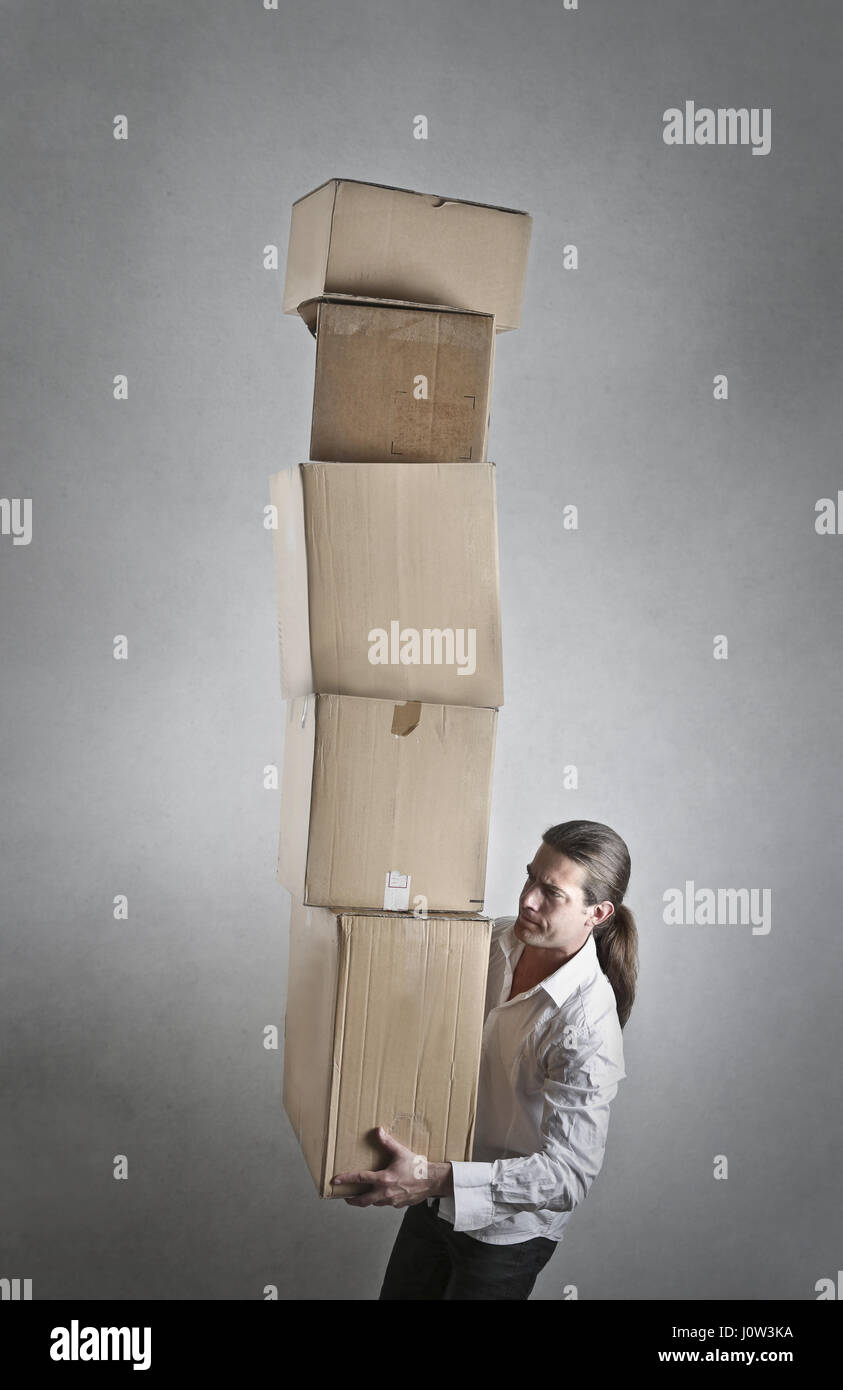 Carrying heavy boxes hires stock photography and images Alamy