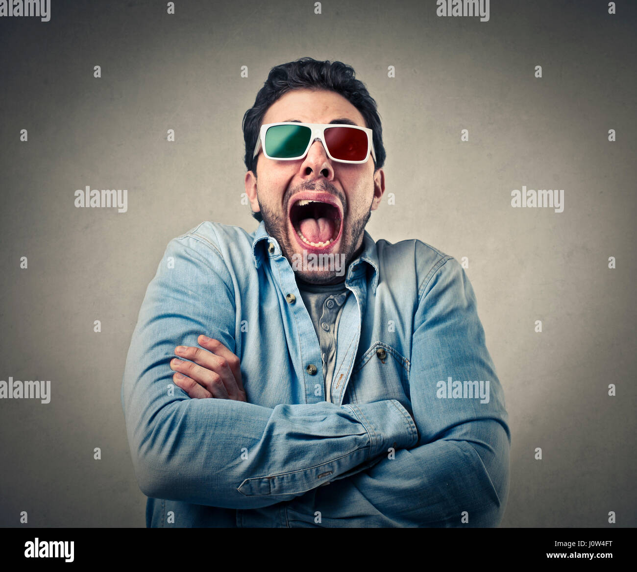 Scared man with 3D glasses Stock Photo