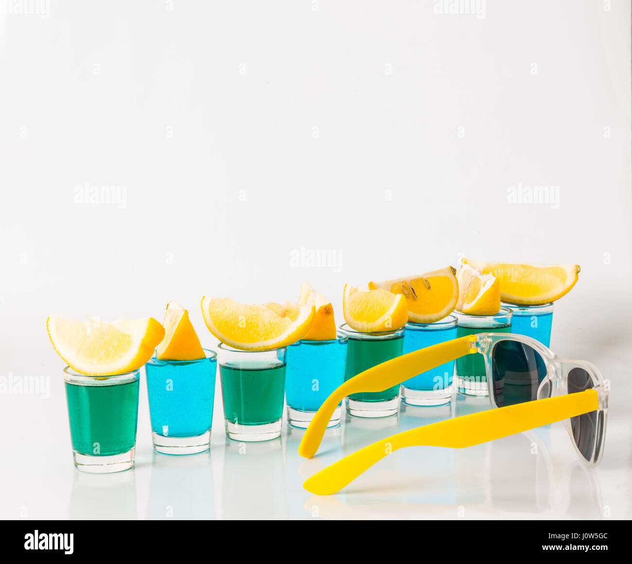 Glasses with blue and green kamikaze, glamorous drinks, mixed drink