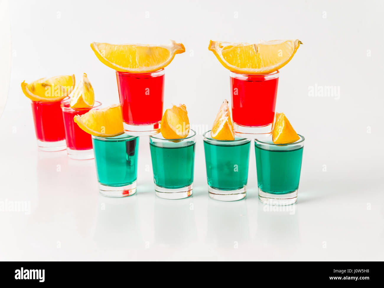 Glasses with green and red kamikaze, glamorous drinks, mixed drink