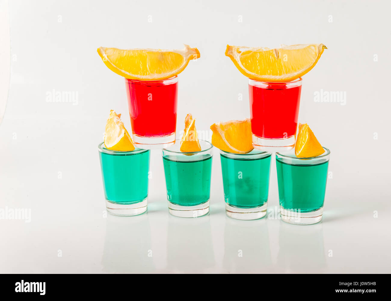 Glasses with green and red kamikaze, glamorous drinks, mixed drink