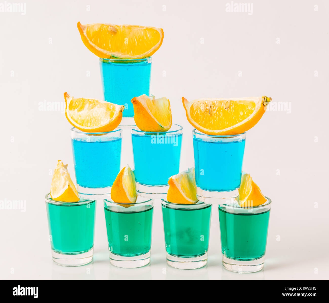 Glasses with blue and green kamikaze, glamorous drinks, mixed drink