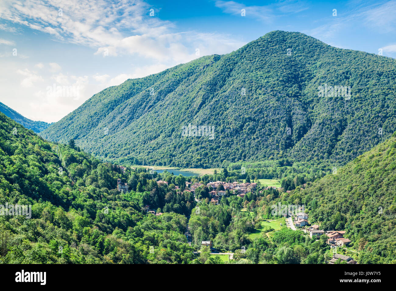 Valganna with Ganna and Lake Ganna, province of Varese, north Italy. Aerial view of Valganna in a beautiful summer day Stock Photo